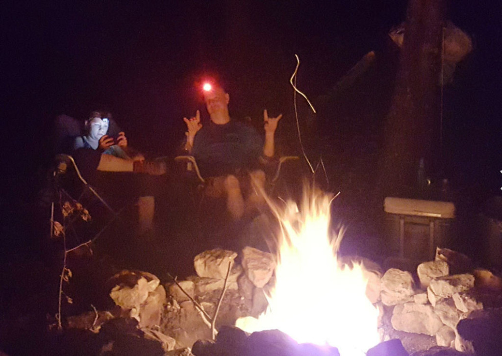 Richard Lonski Relaxing by Campfire